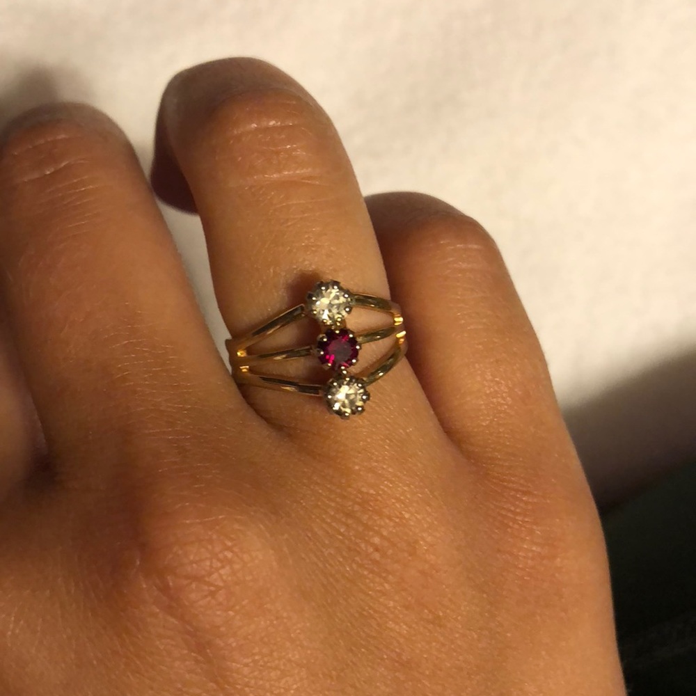 gold ring with white and red gems